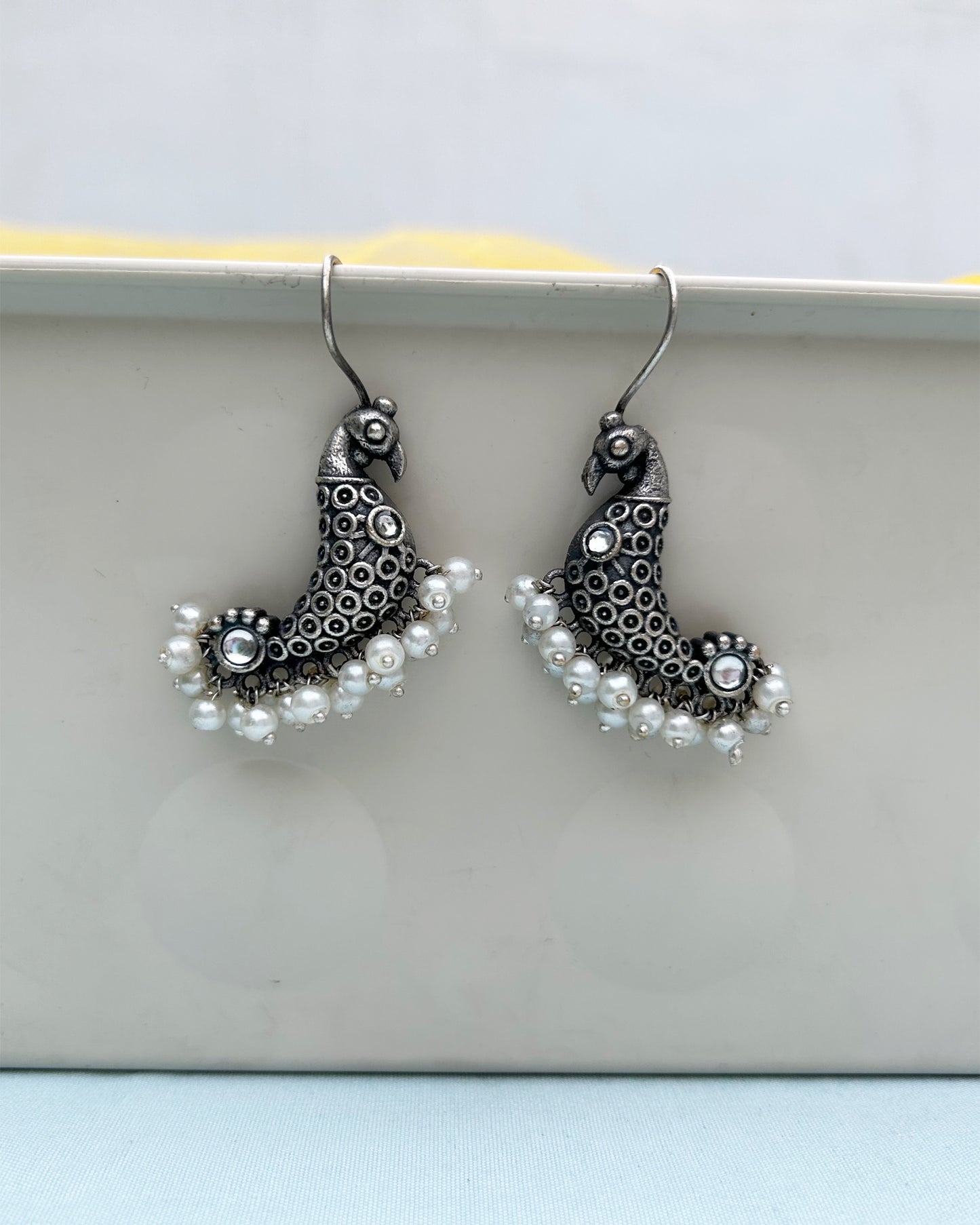 White Peacock Antique Polish Dangler