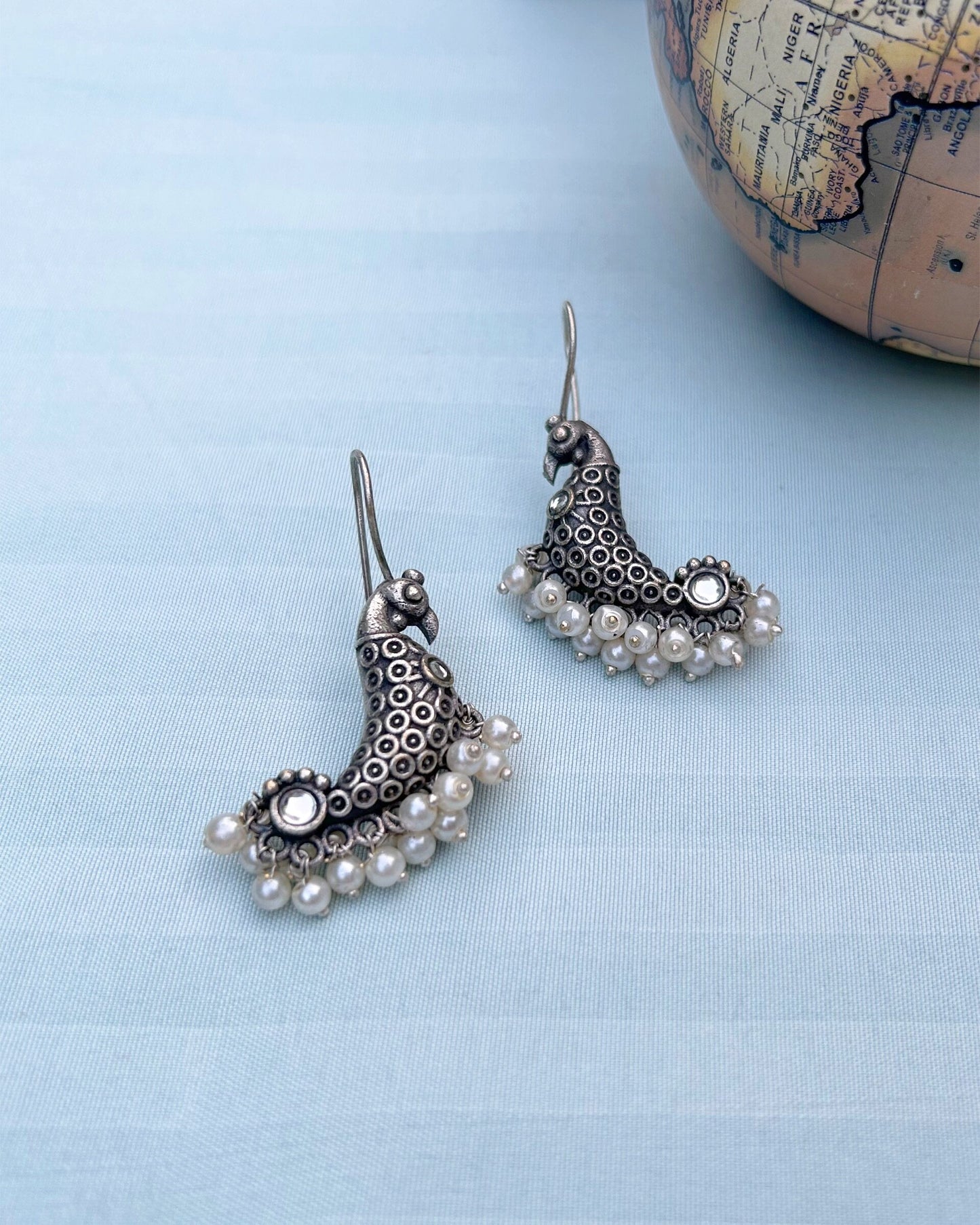 White Peacock Antique Polish Dangler