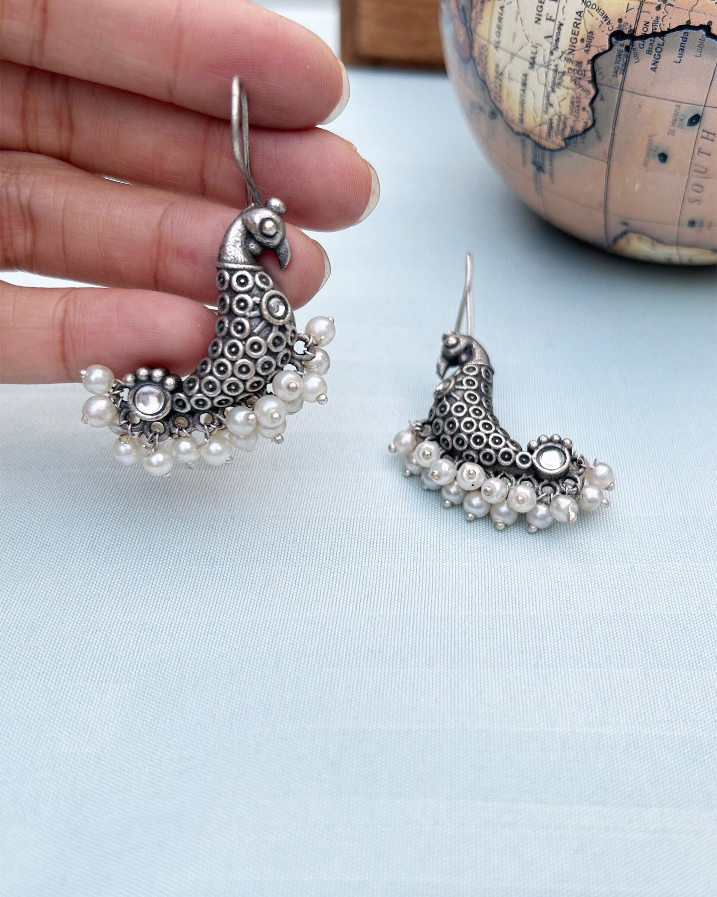 White Peacock Antique Polish Dangler