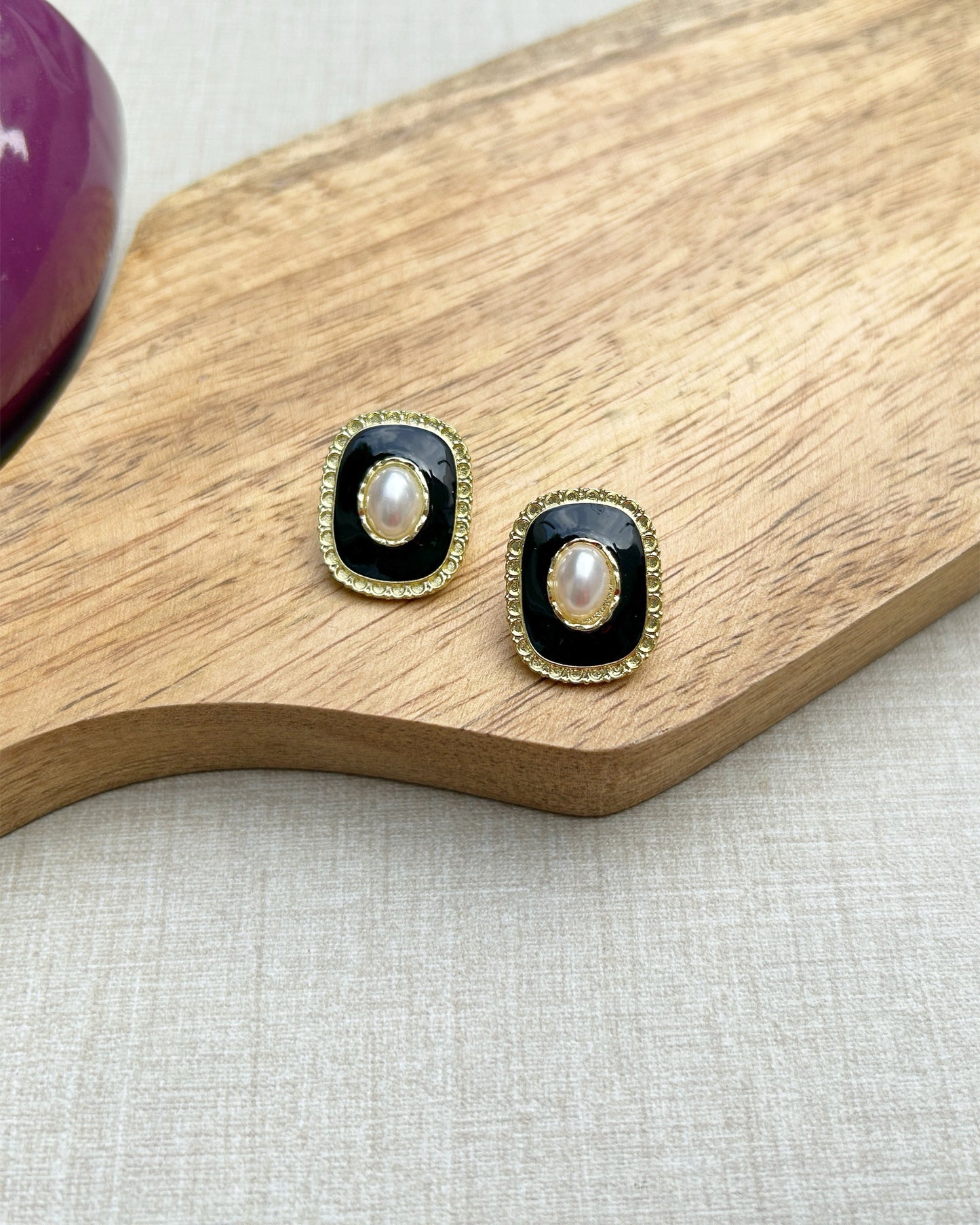 black ear studs