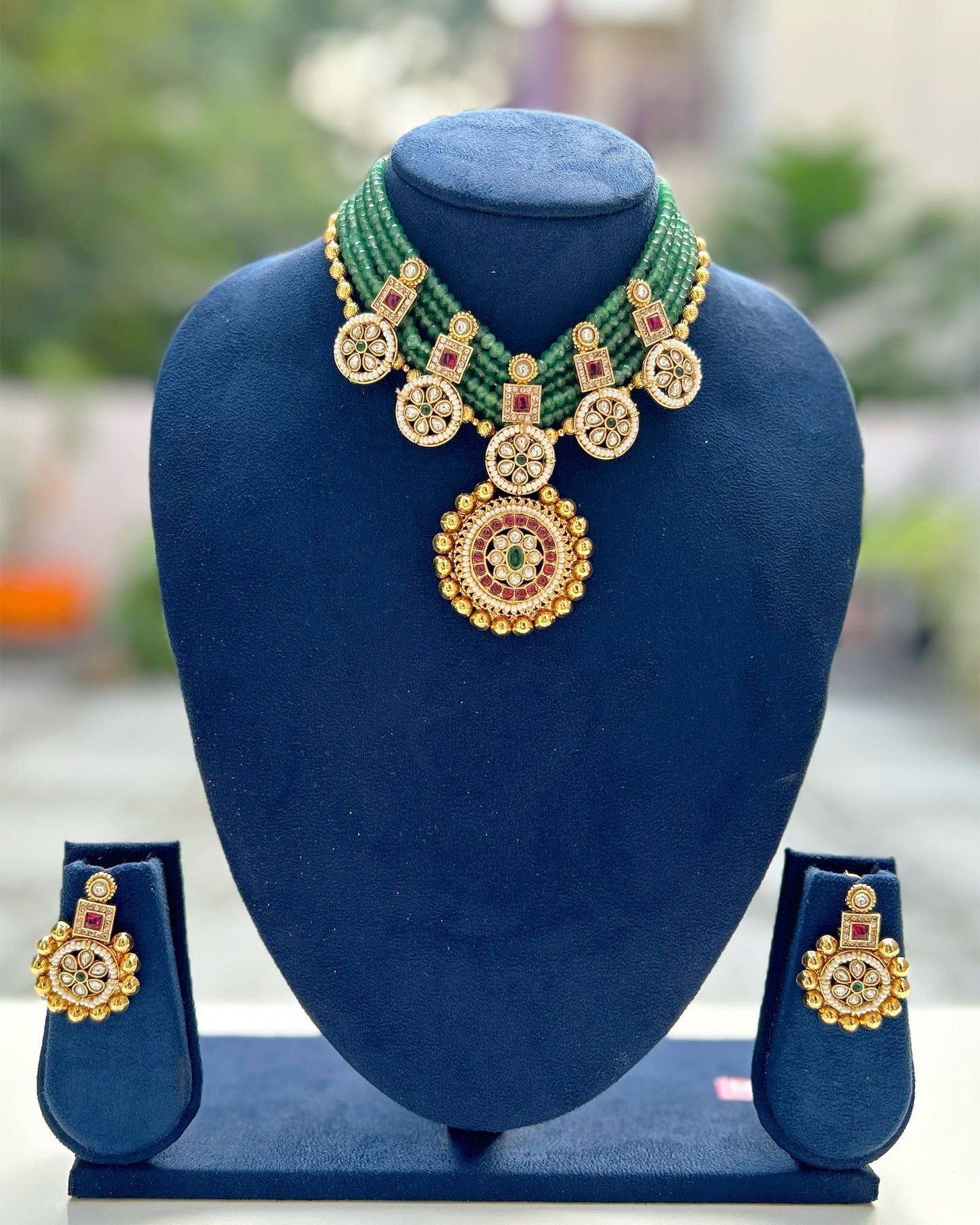 gold and green necklace