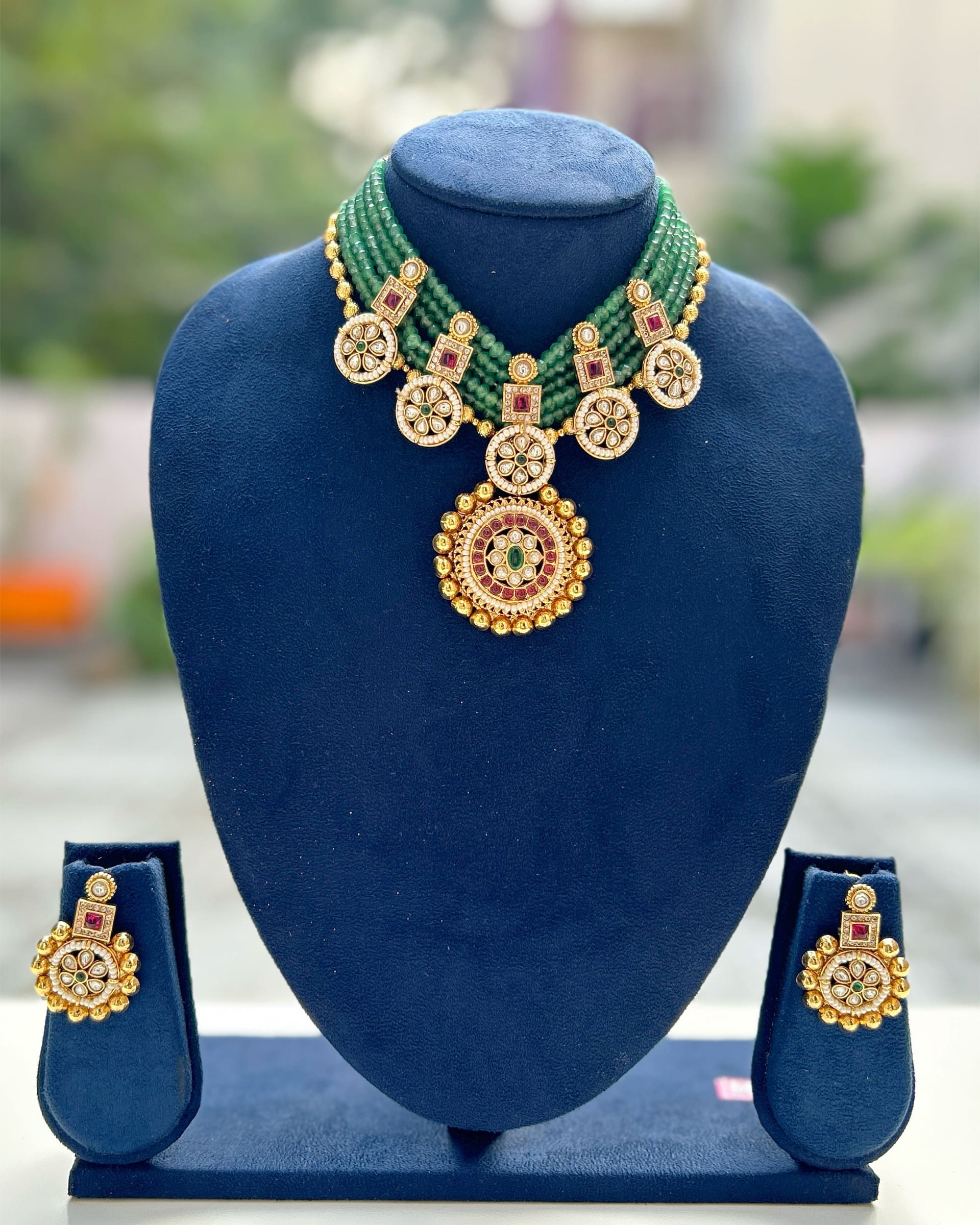 gold and green necklace
