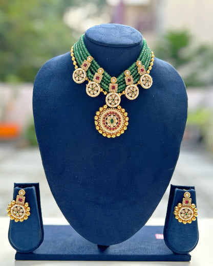 gold and green necklace