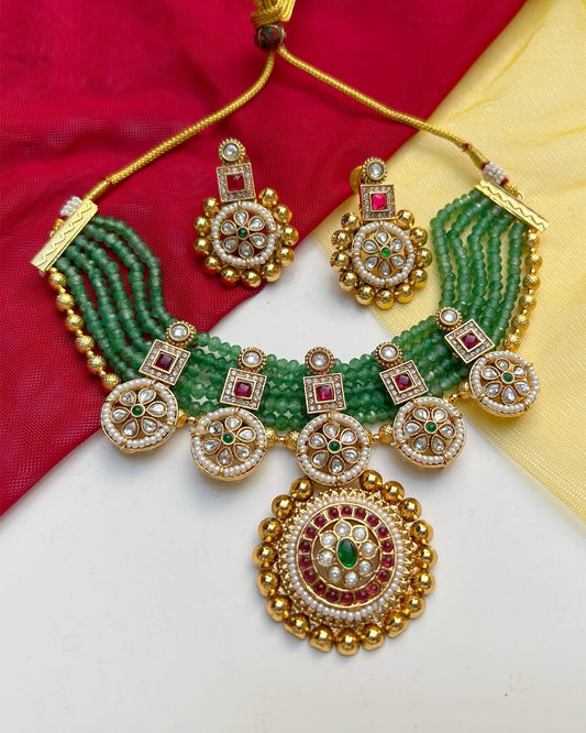 gold and green necklace