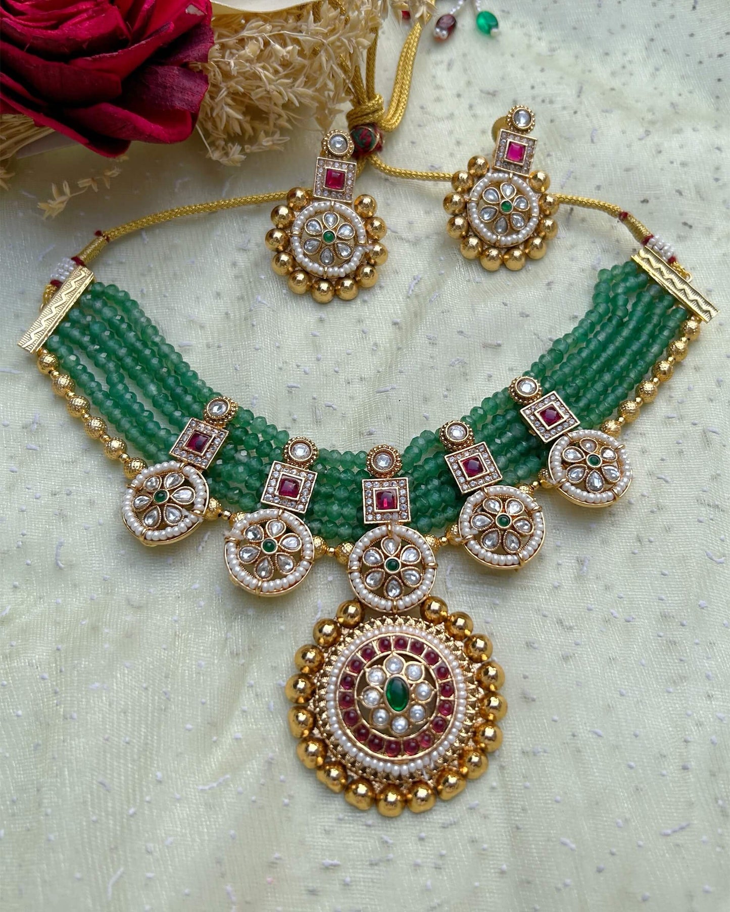 gold and green necklace